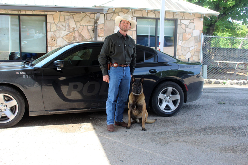 Chief Dustin Breshears with K9 Officer Cezar next to Ingram Police Department Patrol Car.