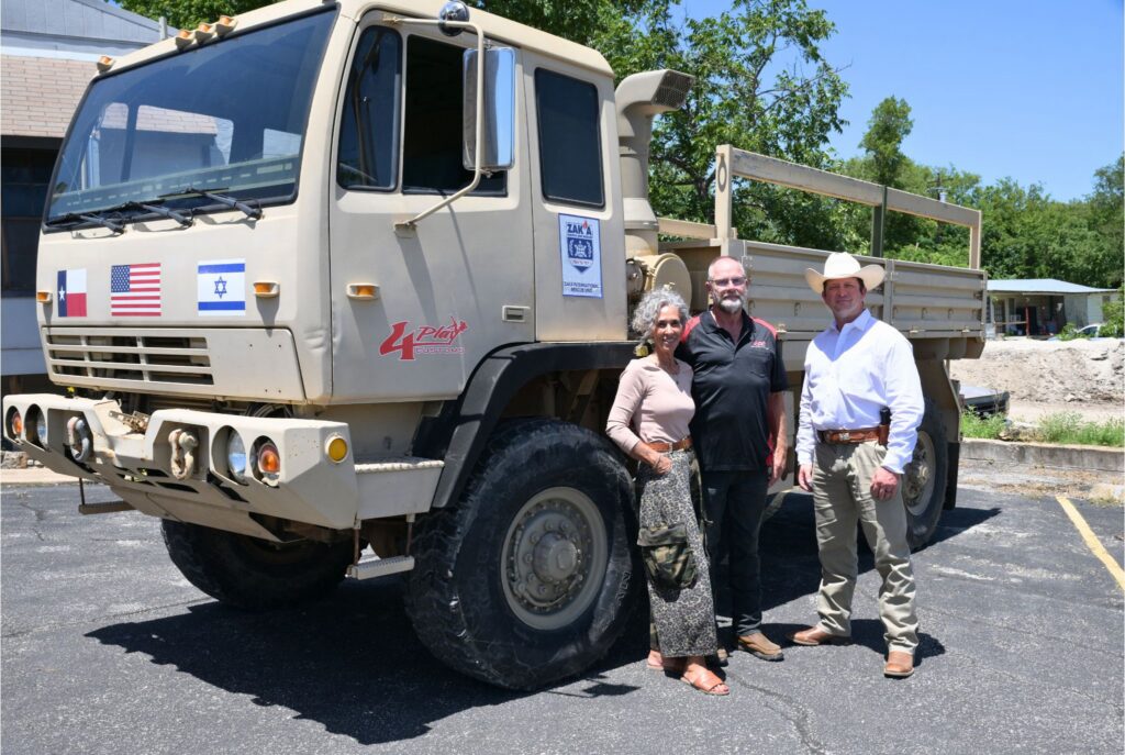 Chief Breshears pictured with the owners of 4Play Customs and their impressive utility vehicle that assisted the Ingram PD during the 2026 flood.